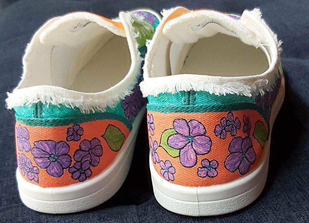 multi-colored hand painted shoes with hydrangeas and leaves