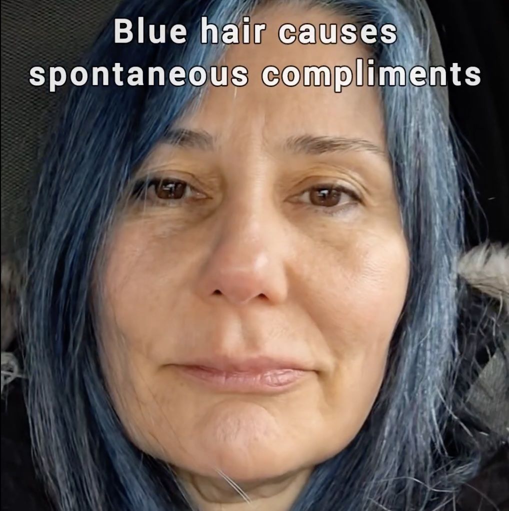 woman with blue hair reacts to husband's spontaneous compliments