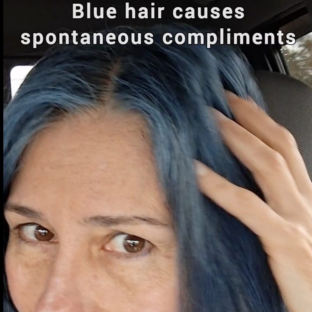 woman with blue hair reacts to husband's spontaneous compliments